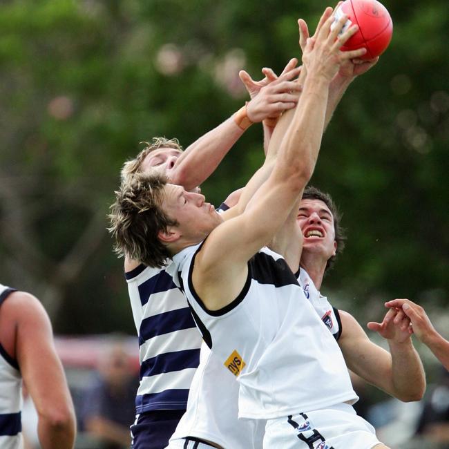 Queensland AFL match between Broadbeach Cats and Southport Sharks at Dunlop Oval, Broadbeach. Southport's Nick Barling flies high.