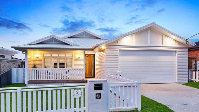 A picturesque white picket fence and classic front porch now offer immediate street appeal.