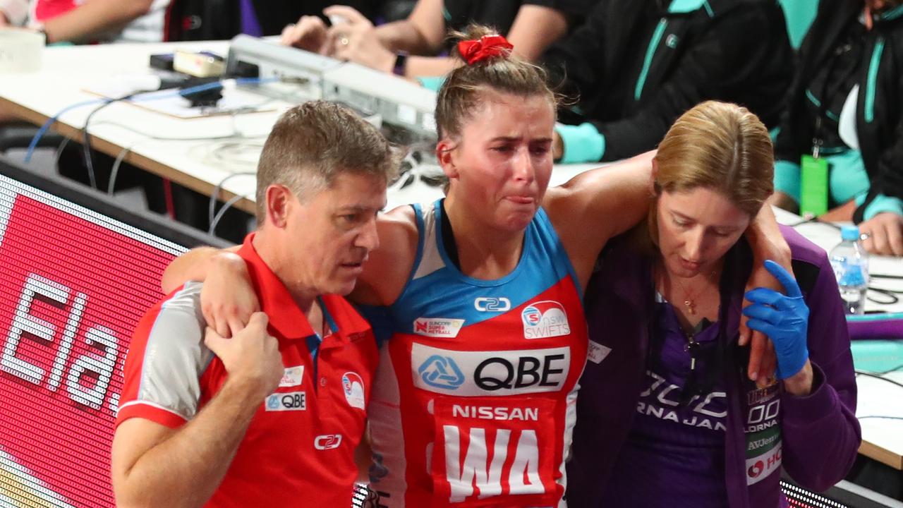 Proud is taken from the court while playing for the Swifts. Picture: Getty