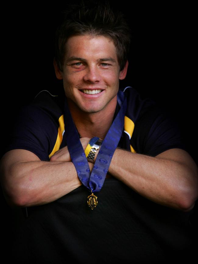 Cousins shows his Brownlow Medal at Subiaco Oval in Perth.