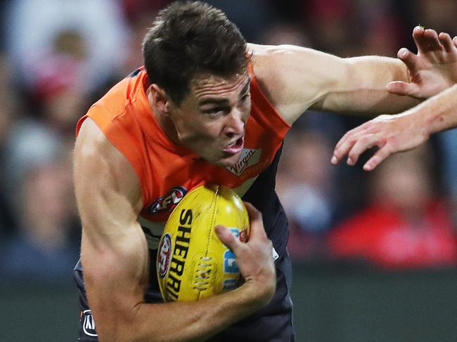 Giants Jeremy Cameron tackled by Sydney's Dane Rampe during the AFL Derby match between the Sydney Swans and GWS Giants at the SCG. Picture. Phil Hillyard