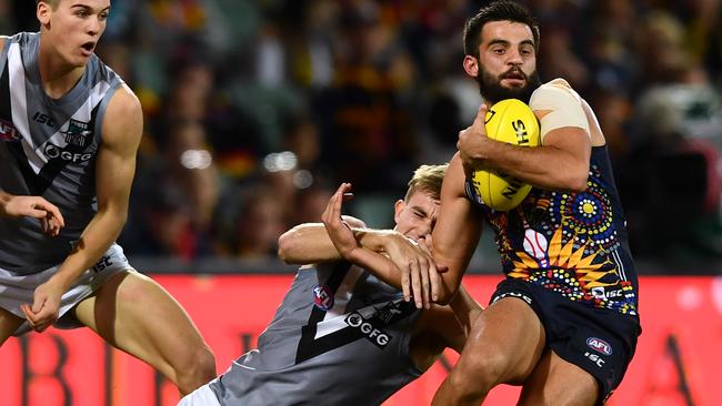 Port Adelaide’s Dougal Howard catches Crow Wayne Milera in Showdown 45. Picture: Mark Brake/Getty