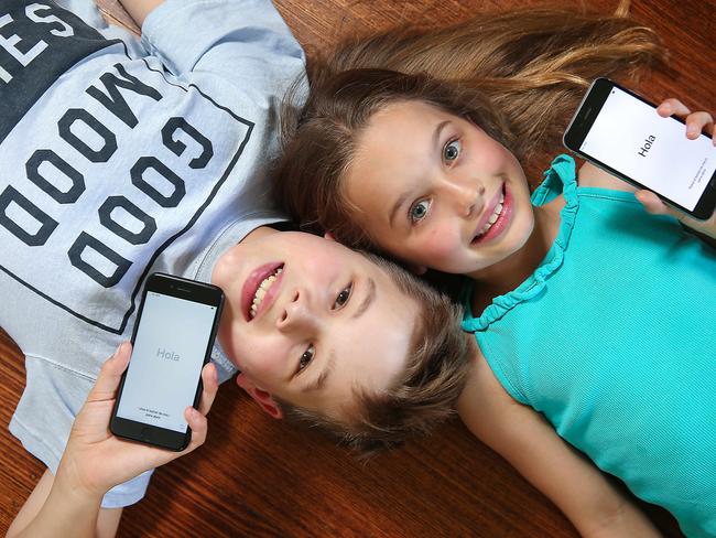 MoneysaverHQ.Story about buying kids cheaper mobile phones over Christmas.Brother and sister Jake 10yrs and Chloe 9yrs with mobile phones.Picture : Ian Currie