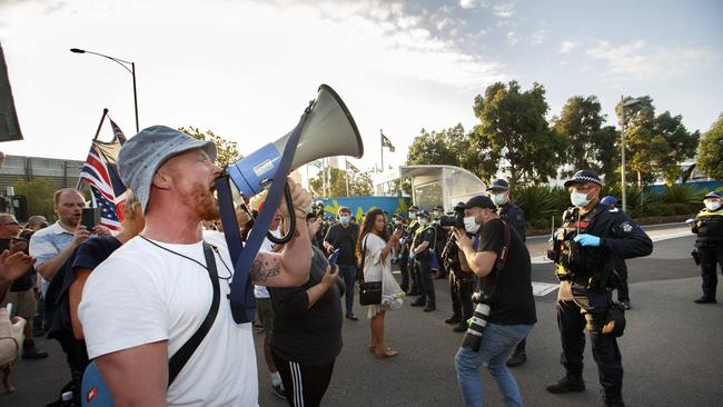 Anti-lockdown protesters march to the Australian open at Melbourne Park on Friday evening Picture: David Geraghty