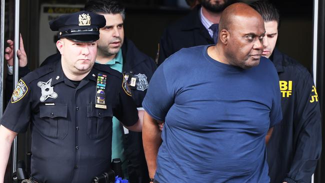 Suspect Frank James is led by police from Ninth Precinct after being arrested for his connection to the mass shooting at the 36th St subway station in New York City.