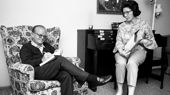 Truman Capote signing copies of In Cold Blood with Harper Lee in 1966.