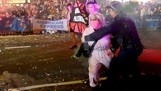 Pro-Palestine protesters are arrested by Police during the Mardi Gras celebrations through Oxford street. Picture: NCA NewsWire / Jeremy Piper