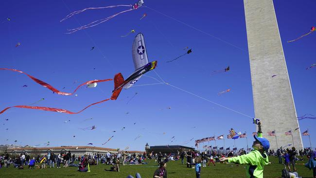 A boy flies his kite by the Washington Monument during the annual Blossom Kite Festival in March 2018. Picture: AFP