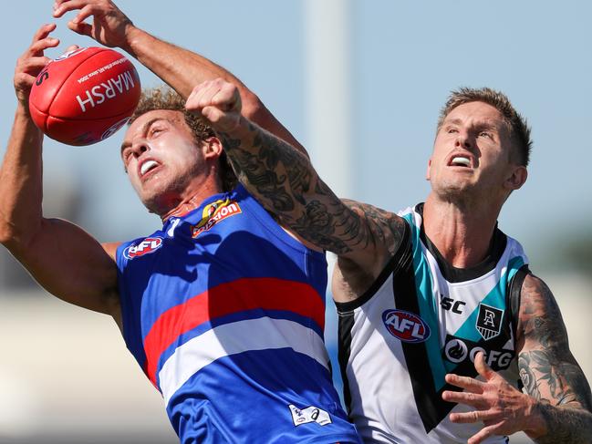 WHYALLA, AUSTRALIA - MARCH 07: Mitch Wallis of the Bulldogs class with Hamish Hartlett of the Power during the 2020 Marsh Community Series match between the Port Adelaide Power and the Western Bulldogs at Bennett Oval on March 07, 2020 in Whyalla, Australia. (Photo by Matt Turner/AFL Photos via Getty Images)