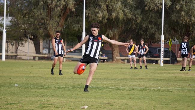 Merbein's Josh Carmichael kicks a goal on the run in the Sunraysia league last year. Picture: Michael DiFabrizio