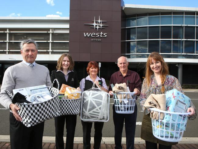 (L-R) Wests CEO Tony Mathew, Wests Leagues Marketing Assistant Elisha Dunn, MHSC members Cathy Chopping, Ken Barnard and Erin Redmond pose for a photo at Leumeah, Friday, 6th July 2018. Wests Macarthur Group is supporting “Do Something Day “ this year with an exciting partnership with Macarthur Homelessness Steering Committee (MHSC). (AAP Image / Robert Pozo).