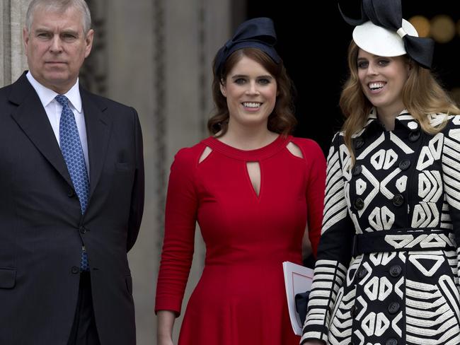 Prince Andrew with daughters Princess Eugenie and Princess Beatrice of York. Picture: Justin Tallis/AFP