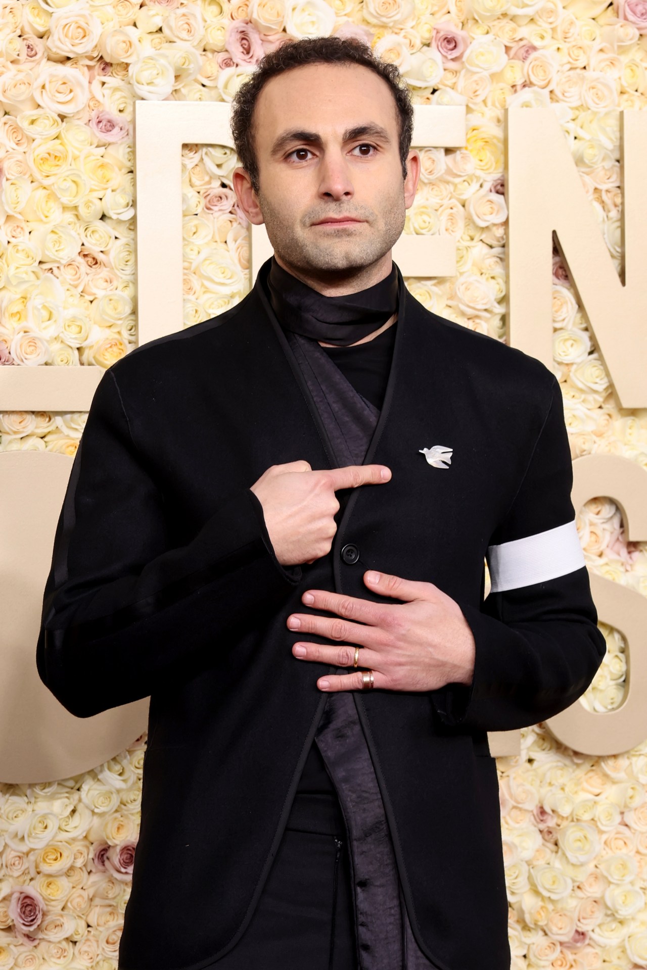 <p><em>Image credit: Getty Images</em></p><h3>Khalid Abdalla</h3><p><em>The Crown</em> actor Khalid Abdalla kept the accessories small, but meaningful to go along with his Thom Browne suit. On his lapel, he wore a small white dove that was made in Bethlehem, to signify his support of a ceasefire in the current Israel-Palestine conflict.</p><p><a href="https://www.newsletters.news.com.au/vogue"><i>Sign up to the Vogue newsletter</i></a></p>