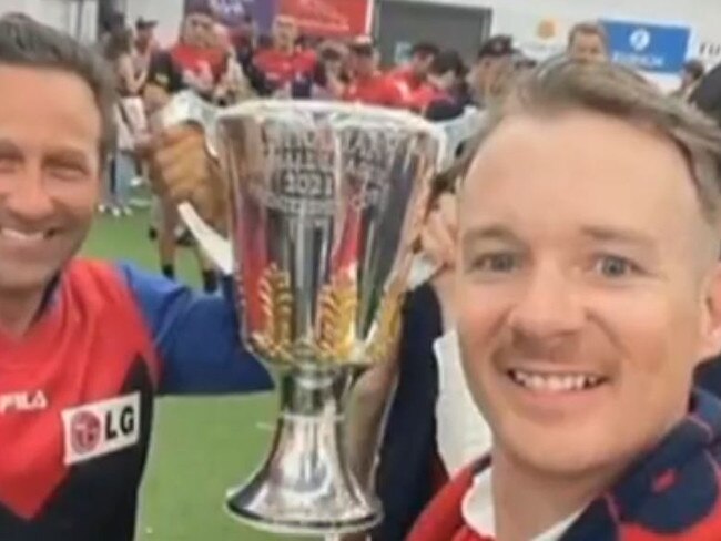 Burbank and Mark Babbage with the premiership cup in the club’s rooms.