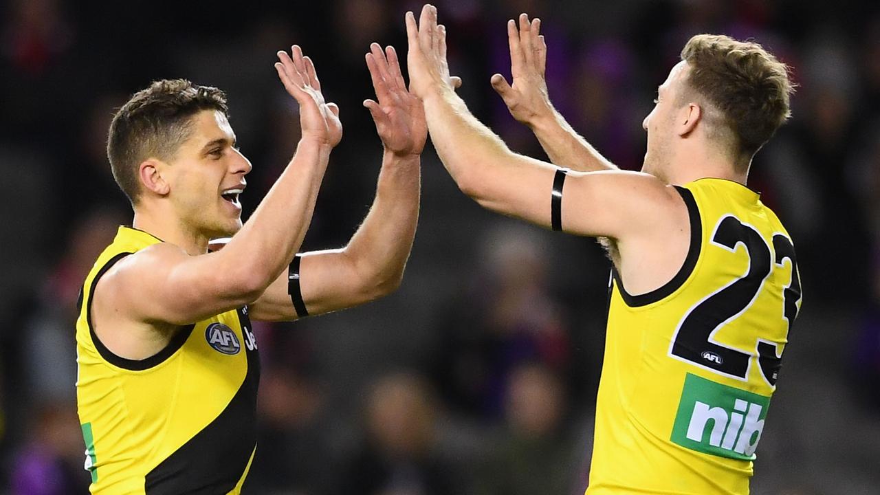 Dion Prestia and Kane Lambert celebrate a goal. (Photo by Quinn Rooney/Getty Images)