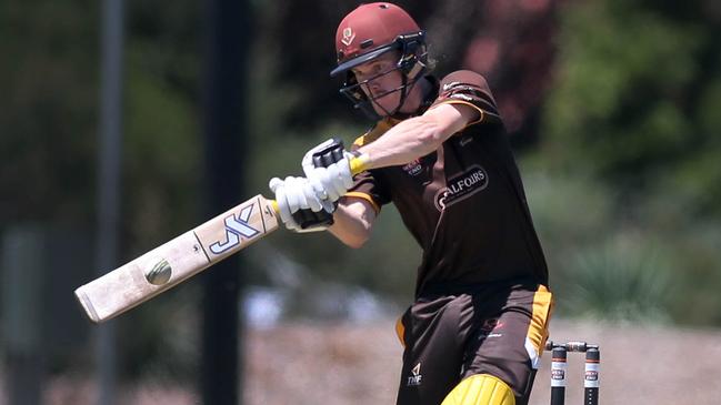 Kensington’s Josh Doyle smacks one to the boundary against East Torrens. Picture: Dean Martin