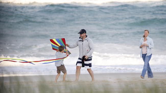 Adam Whittington and wife Karin enjoy a family day at a Gold Coast beach during filming for the Seven Network. Picture: Nathan Richter / INF