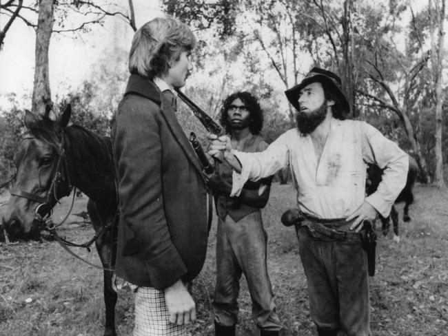 Actors John Hargreaves, David Gulpilli and Dennis Hopper (right) in a scene from the 1976 film Mad Dog Morgan.