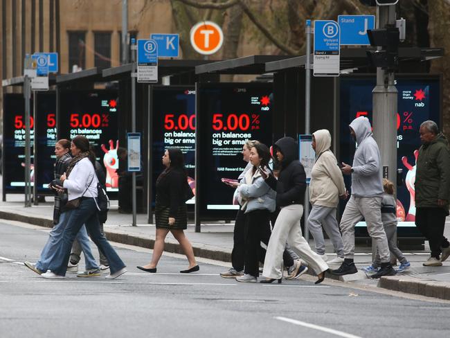 SYDNEY, AUSTRALIA : Newswire Photos- JULY 16 2024: A general stock photo of people crossing York Street at Wynyard Station alongside the bus stops in the Sydney CBD near Wynyard Station. Picture: Newswire /Gaye Gerard