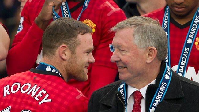 Manchester United's Wayne Rooney with manager Alex Ferguson after Ferguson's last home game in charge of the club