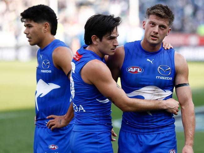 Paul Curtis, Zac Fisher and Darcy Tucker of the Kangaroos look dejected after their loss in Geelong. Picture: Michael Willson/AFL Photos via Getty Images.