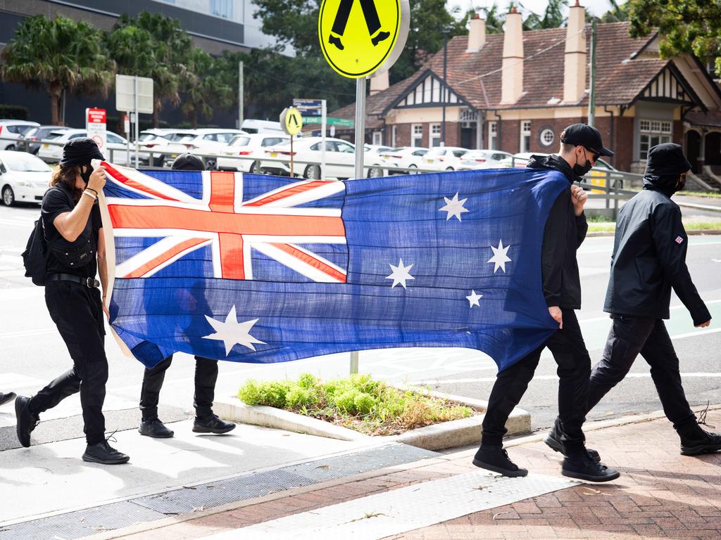 Members of the National Socialist Network are given a move on order from the police and march through North Sydney and St Leonards. Picture: Tom Parrish