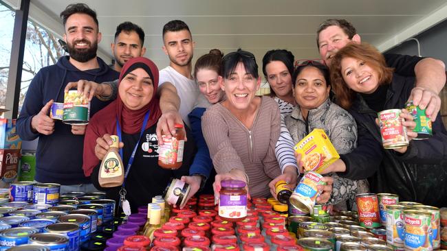 Staff and volunteers prepare to help customers when The Staples Bag op-up shop opens at MDSI Blue House, in Campbelltown, every second Wednesday.