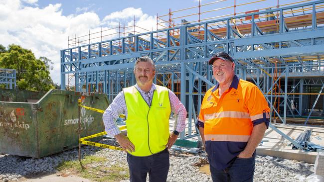 John Brady, Mates in Construction Founder and Queensland CEO and Peter Wood, Villaworld Homes by AVID Property Group General Manager Housing at the Sphere construction site in Southport. Picture: Jerad Williams.