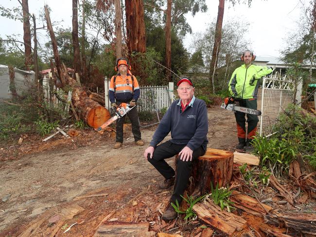 Mirboo North storm damage and clean up, volunteers Scott Melzer from Druin, #042143508, (orange)  and Scott Eastwood from Poowong, #0457519302, working on   damage on Lindsay Oates property, #0408343531,   Picture Yuri Kouzmin