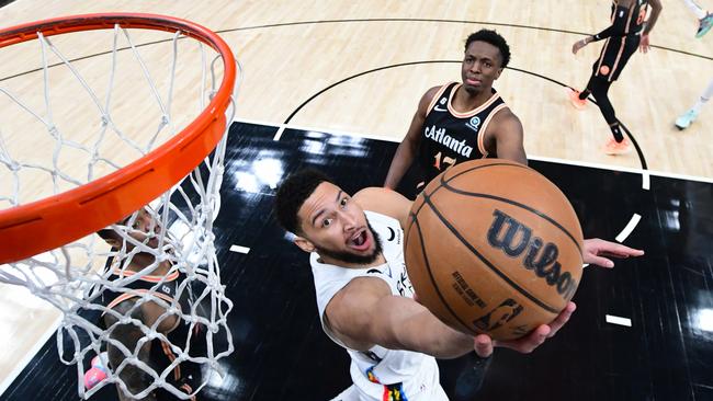 Ben Simmons drives to the basket during the game against the Atlanta Hawks. (Photo by Adam Hagy/NBAE via Getty Images)
