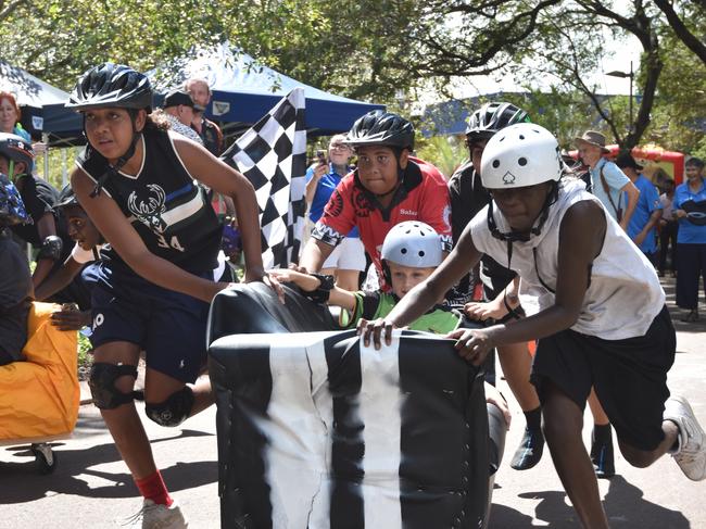 The 'Palmy Army' from the Palmerston Youth Drop In Centre, led by Lorenzo Retchford (left) at Anglicare NT and the City of Darwin's Couch Surfing races 2024. Picture: Alex Treacy