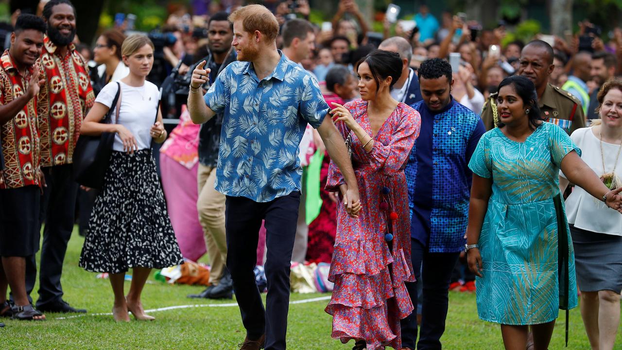 Harry and Meghan visit the University of the South Pacific in Suva, with the Duke dressed in a local Fijian shirt. Picture: Phil Noble.