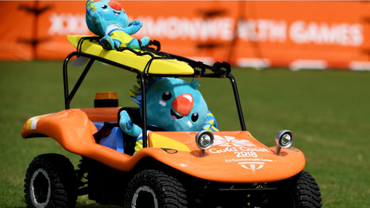 97: In one of the many lighthearted moments of this friendly Games, mascot Borobi drives a beach buggy to collect the discus during day eight of competition at the Carrara Stadium. Picture: AAP.