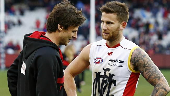 Essendon v Melbourne Alex Browne tackled by Jeremy Howe 2nd term Browne went off jnjured Picture:Wayne Ludbey