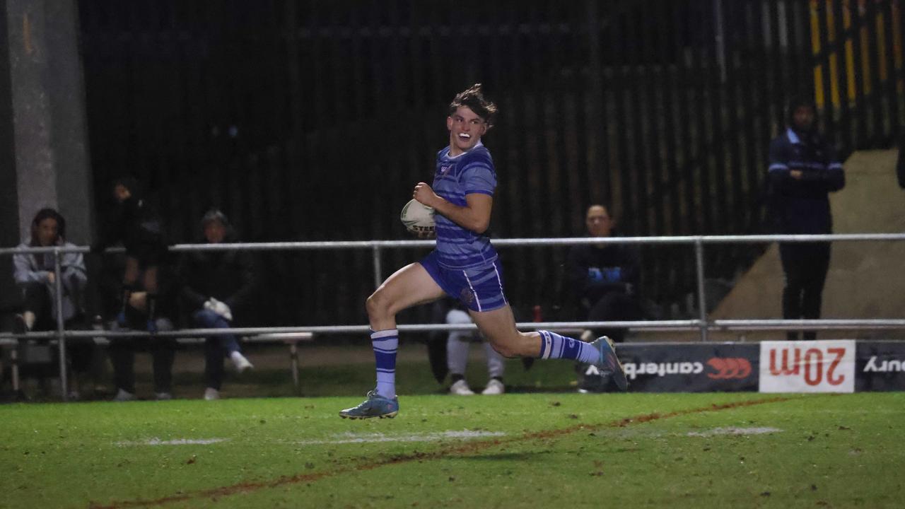 Jesse Williams races away for a try for Patrician Brothers, Fairfield. Photo: Tim Pascoe