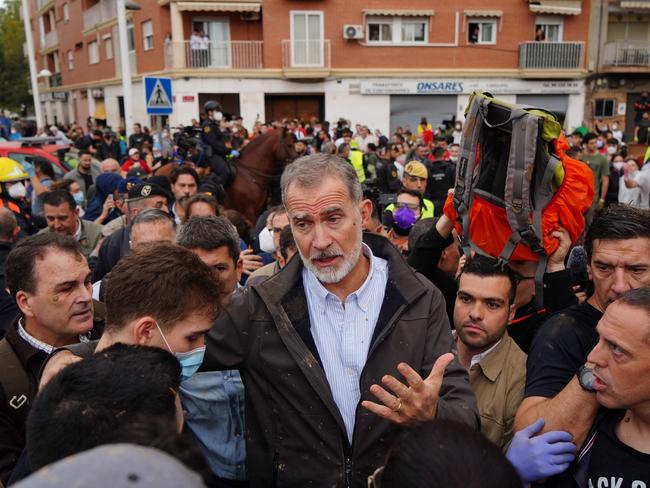 King Felipe VI of Spain is heckled by angry residents during his visit to Paiporta. Picture: AFP