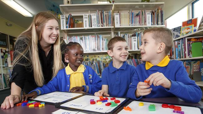 Tutor Nicole Douglas with Melton West Primary students, Nyaluak Ngong, Hercule Gadsden and Connor McCartney. Picture: David Geraghty