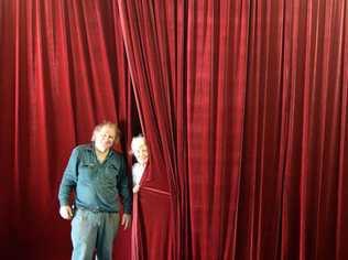 CURTAIN'S UP: Christopher Desgrand and Judith Flitcroft with the newly installed curtain at the Stanthorpe Little Theatre just in time for Guys and Dolls. Picture: Contributed