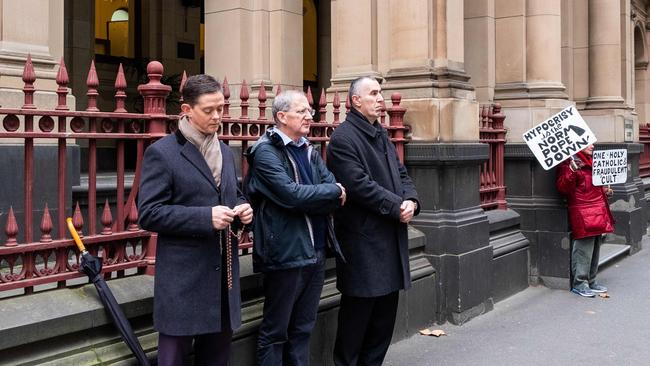 Supporters of Australian Cardinal George Pell outside the court.