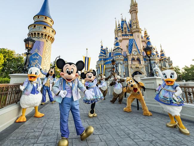 Beginning Oct. 1, 2021, Mickey Mouse and Minnie Mouse will host “The World’s Most Magical Celebration” honoring the 50th anniversary of Walt Disney World Resort in Lake Buena Vista, Fla. Mickey and Minnie will be joined by their best pals Donald Duck, Daisy Duck, Goofy, Pluto and Chip ‘n’ Dale all dressed in sparkling new looks, custom-made for the 18-month event, highlighted by embroidered impressions of Cinderella Castle on multi-toned, EARidescent fabric punctuated with pops of gold. (Matt Stroshane, photographer)  Photo - suppliedESCAPE 18 SeptDisney World