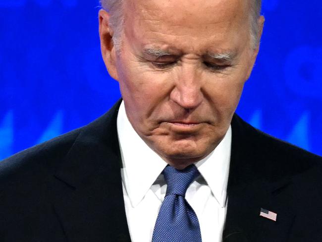 US President Joe Biden looks down as he participates in the first presidential debate of the 2024 elections with former US President and Republican presidential candidate Donald Trump at CNN's studios in Atlanta, Georgia, on June 27, 2024. (Photo by Andrew CABALLERO-REYNOLDS / AFP)