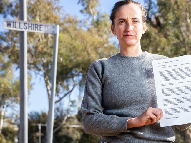 Suki Dorras-Walker with a letter she has written to the Alice Springs Town Council requesting that the name of Willshire Street be changed. Picture: EMMA MURRAY