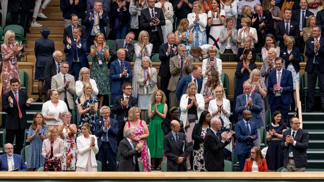 The Royal Box stands and applauds University of Oxford vaccinologist Dame Sarah Gilbert (seated in red, bottom right) at Wimbledon last week. Picture: Getty Images