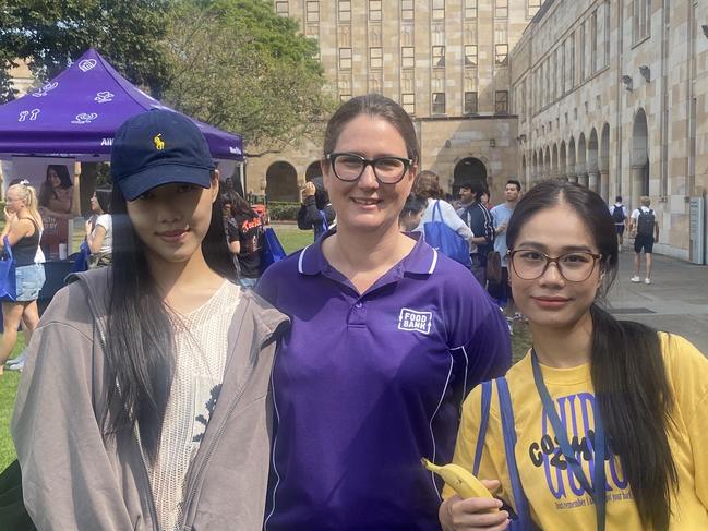 Foodbank Queensland CEO Jess Watkinson with UQ students Xiao Zhang and Yexian Yang from China. Photo: Rose Innes