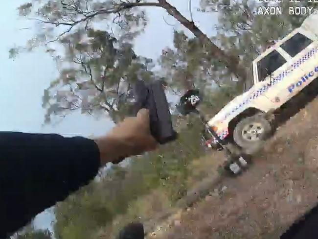 Still from Randall Kirk's body camera running from the Train's Wieambilla property while being shot at.