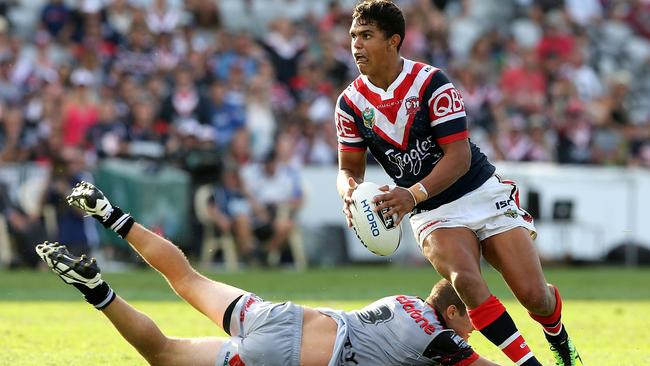GOSFORD, NEW SOUTH WALES - APRIL 03: Latrell Mitchell of the Roosters is tackled during the round five NRL match between the Sydney Roosters and the New Zealand Warriors at Central Coast Stadium on April 3, 2016 in Gosford, Australia. (Photo by Ashley Feder/Getty Images)