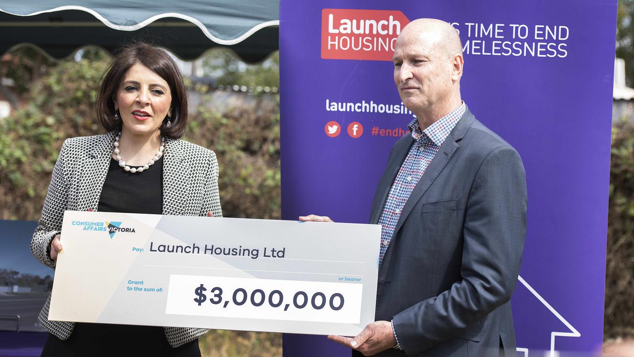 Minister for Consumer Affairs Marlene Kairouz presenting a cheque to Launch Housing in 2018. Picture: Ellen Smith