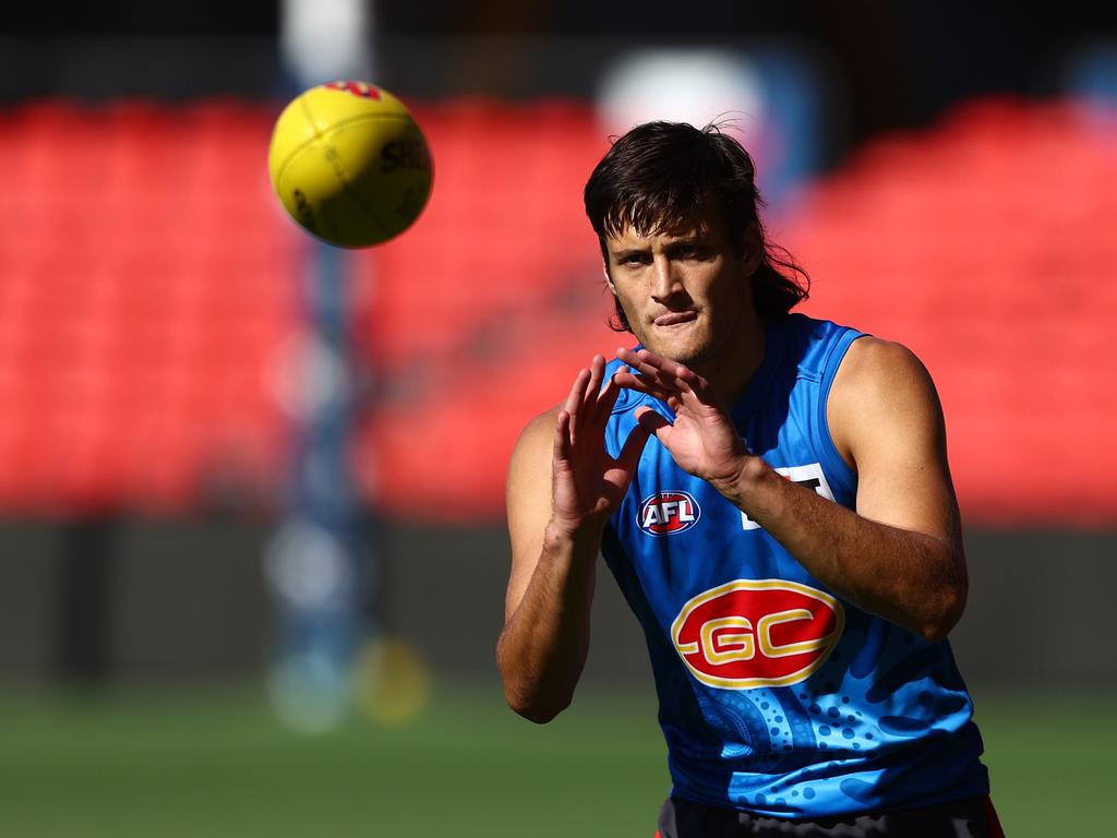 GOLD COAST, AUSTRALIA – JUNE 06: Ned Moyle during a Gold Coast Suns AFL training session at People First Stadium on June 06, 2024 in Gold Coast, Australia. (Photo by Chris Hyde/Getty Images)