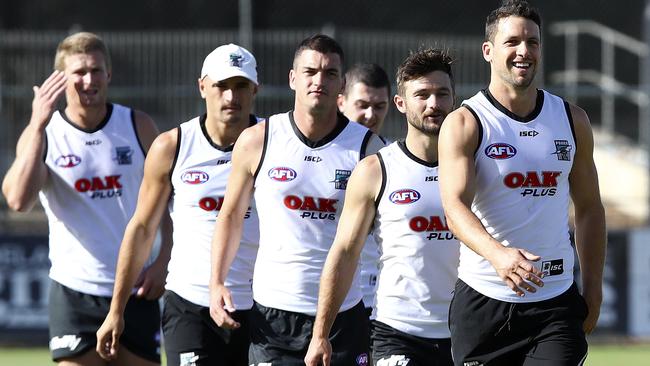 Port Adelaide captain Travis Boak leads Sam Gray, Tom Rockliff and Sam Powell-Pepper at training this week. Picture SARAH REED