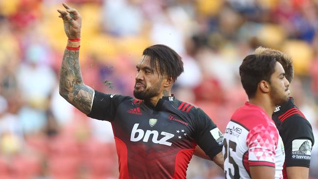 Digby Ioane of the Crusaders celebrates scoring a try at Suncorp Stadium.